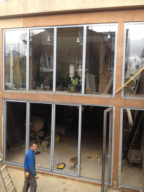 Aluminium bi-fold doors with two-storey glazing in Merton