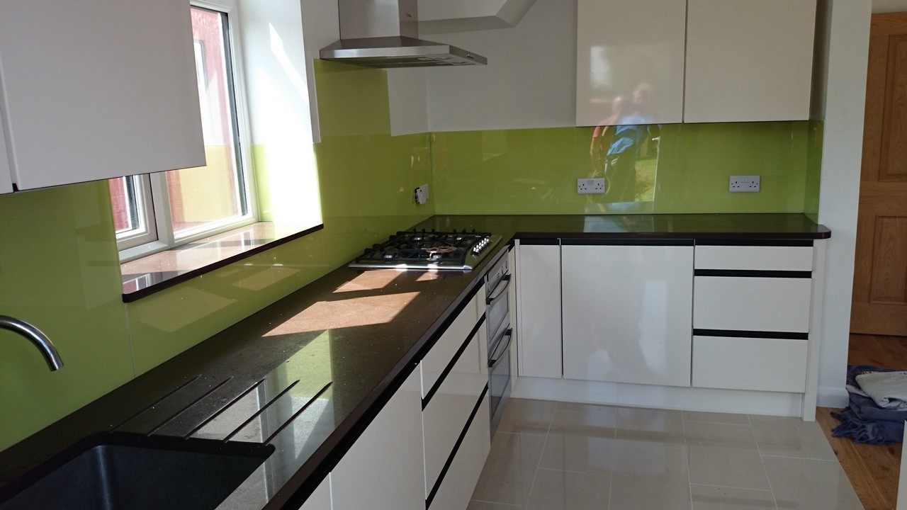 Lime green glass kitchen splashback installed by Merton glaziers