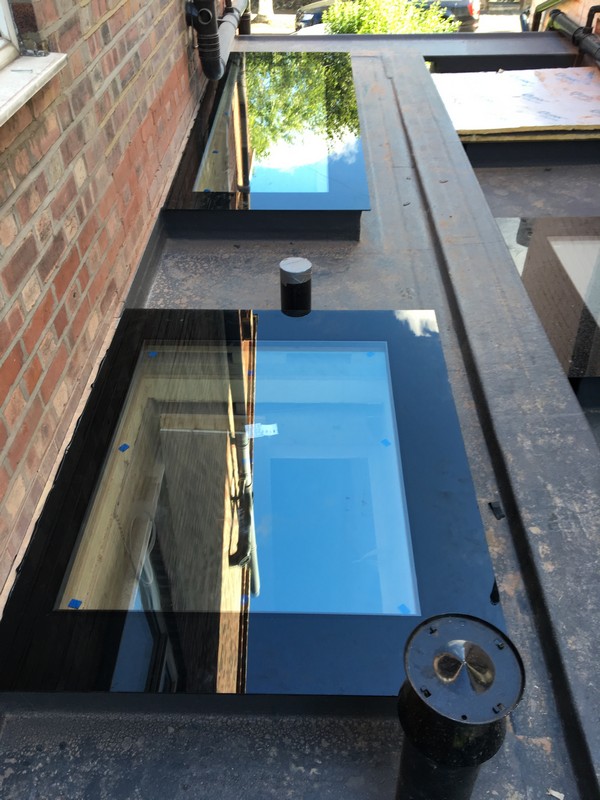 Multiple flat roof skylights on extension in Merton
